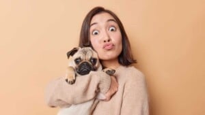 Woman holding pug