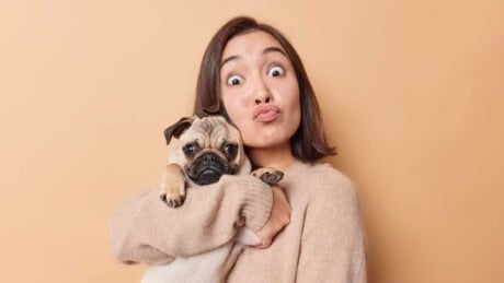 Woman holding pug