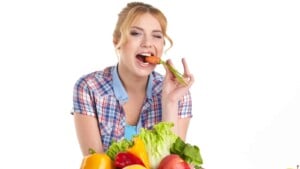 Blonde woman with veggies