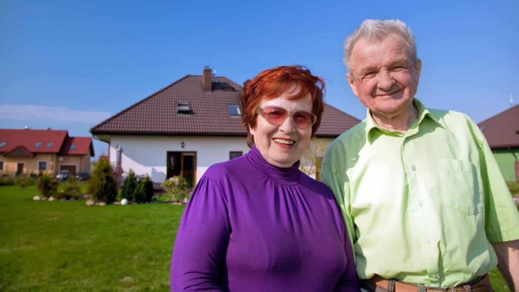 Elderly couple together in the back yard