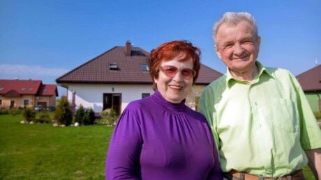 Elderly couple together in the back yard