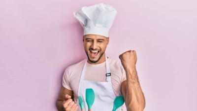 Man in chef's hat celebrating