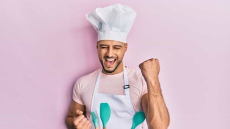 Man in chef's hat celebrating