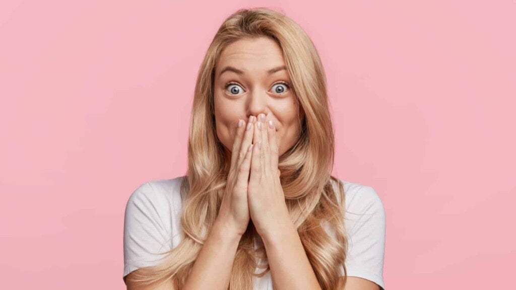 Woman looking surprised and happy