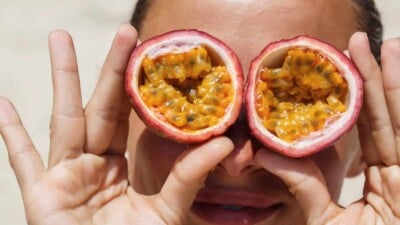 Girl with passion fruits for eyes