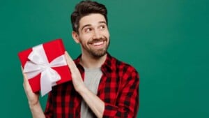 Man smiling with a gift